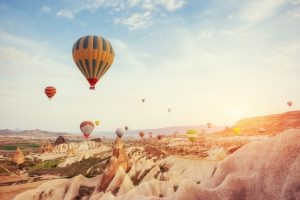 hot air balloon flying over rock landscape at turk 2021 08 29 09 43 23 utc