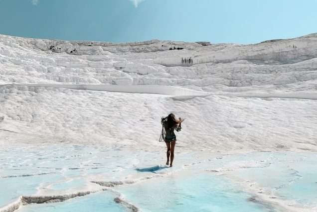 young woman walking by exotic white chalk landscap 2023 02 01 20 50 25 utc