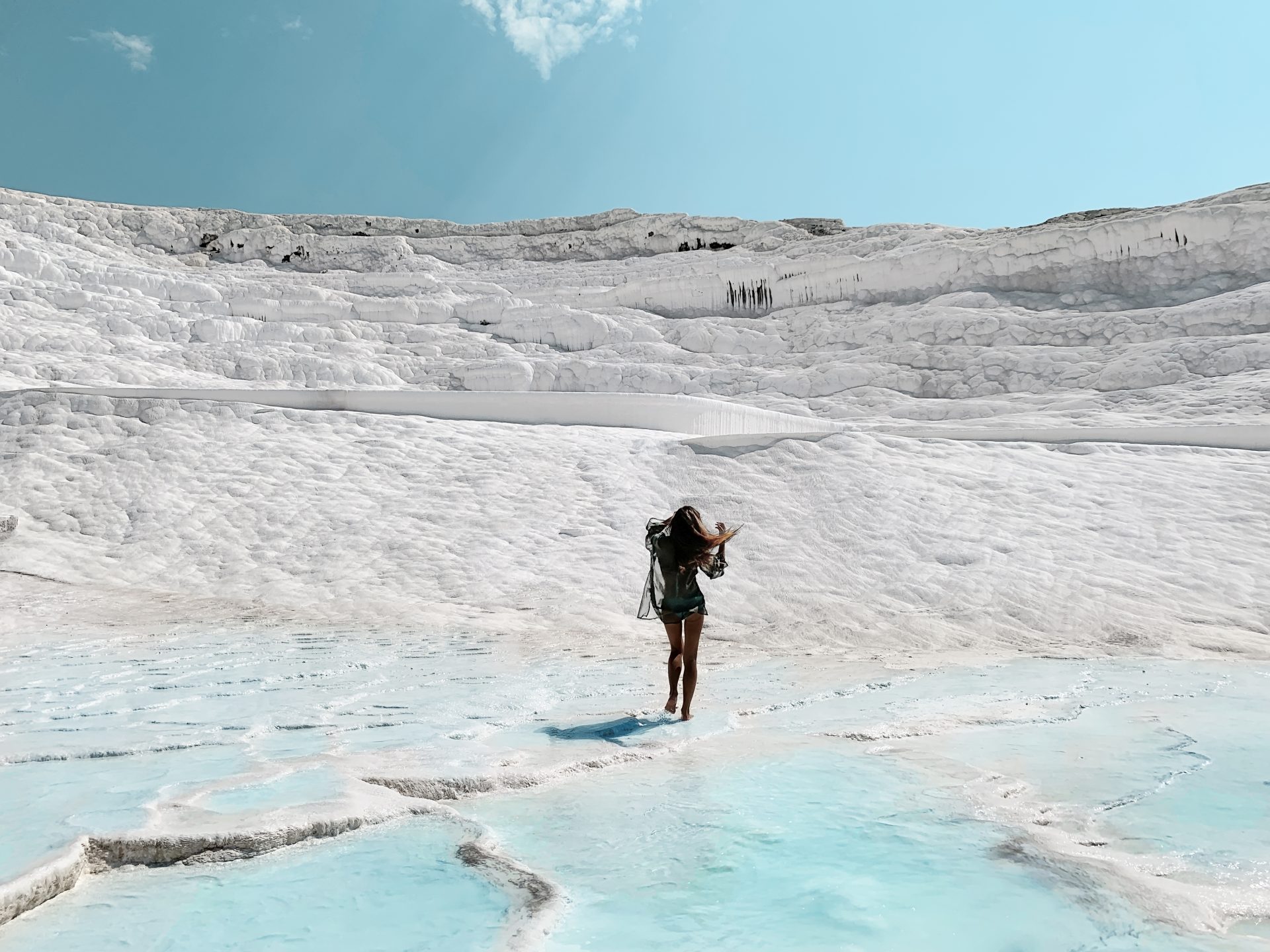 young woman walking by exotic white chalk landscap 2023 02 01 20 50 25 utc